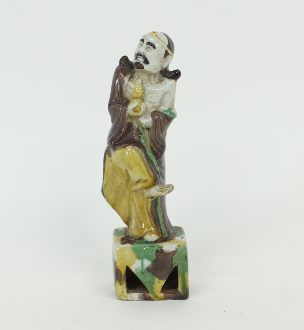A Chinese sancai glazed porcelain figure of a sage