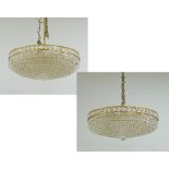 A pair of eight light crystal chandeliers
