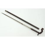 A wooden walking stick / scabbard