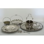 A collection of white metal serving dishes