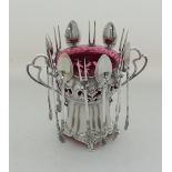 An Art Nouveaux WMF silver plated stand, lined with a red glass jar to take sweetmeat,