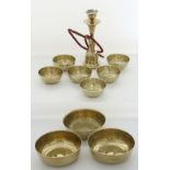 A collection of Middle Easter brass bowls, together with a nargile