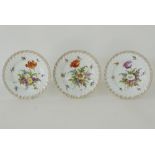 A collection of three hand painted floral Dresden Donath porcelain plates