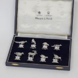A Theo Fennell set of eight cast sterling silver menu card holders