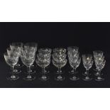 A collection of cut crystal stemmed glasses