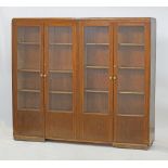 A Cypriot stained beech veneered plywood bookshelf unit