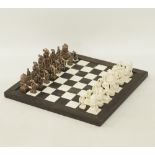 An African carved and stained ivory chess set