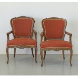A pair of carved walnut side chairs