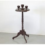 A mahogany smoker's table