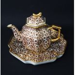 A Chinese porcelain teapot and dish