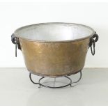 A large tinned copper cauldron