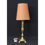 A brass pedestal table lamp