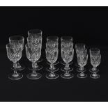 A collection of cut crystal stemmed glasses