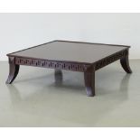 A square mahogany center coffee table