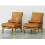 A pair of leather sofa chairs