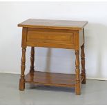 A two tier beechwood side table