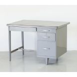 A grey painted metal tanker desk