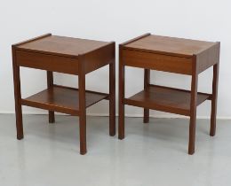 A pair of teak bedside tables