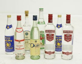 A collection of six bottles of ouzo and two vodkas