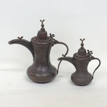 Two Middle Eastern copper coffee pots