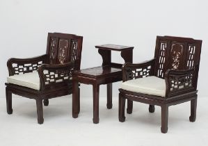 A pair of Chinese style carved open armchairs