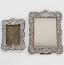 A set of two silver mounted wooden frames