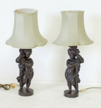 A pair of patinated bronze table lamps