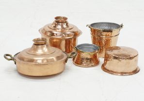 A collection of copper cauldrons