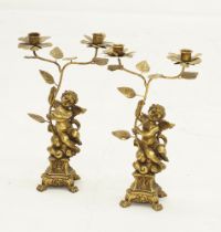 A pair of gilt metal figure candelabra