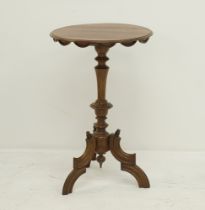 A solid walnut pedestal side table