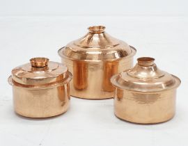 Three lidded copper cauldrons