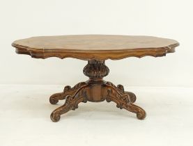 An oval serpentine low center table