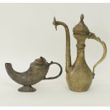 A brass Middle Eastern ewer and a bronze oil lamp