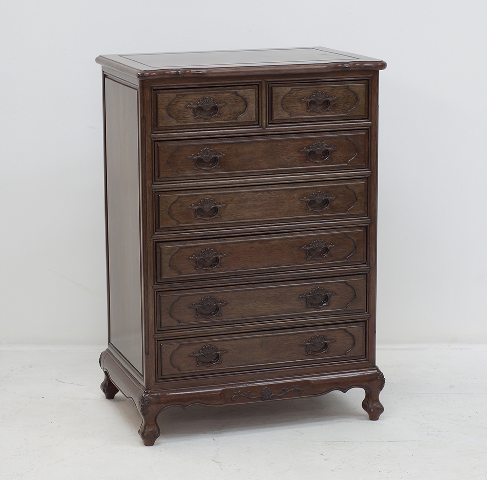 A Chinese style carved mahogany commode
