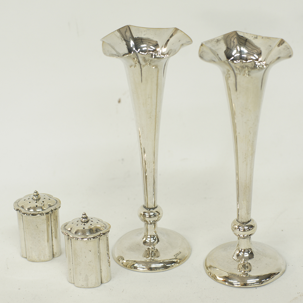 A pair of Chinese silver salt shakers and a pair of silver bud vases