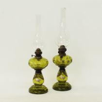 Two table oil lamps.