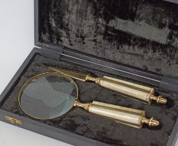 A boxed set of brass and bone desk accessories