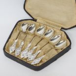 A boxed set of six silver dessert spoons