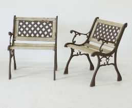 A pair of cast iron and hardwood garden chairs