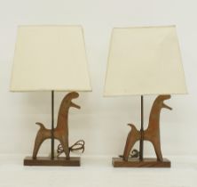 A pair of table lamps with ceramic horses