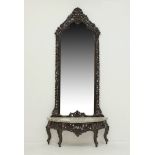 An Asian carved wood mirror and console