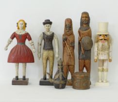 A collection of wooden dolls