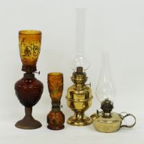Four table oil lamps.