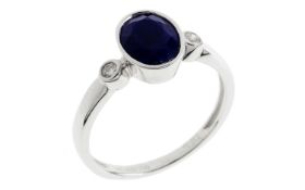 Ring 2.94g 750/- Weissgold mit 2 Diamanten zus. ca. 0.06 ct. und Lapislazuli. Ringgroesse ca. 55