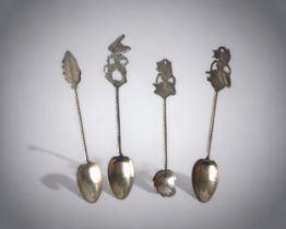 A COLLECTION OF INDONESIAN WHITE METAL SPOONS. THREE WITH 'YOGYA WAYANG' PUPPET FIGURE HANDLES.