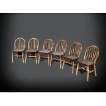 A SET OF SIX ERCOL STICK BACK WINDSOR DINING CHAIRS.
