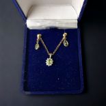A LADIES 9 CARAT GOLD & PERIDOT PENDANT NECKLACE AND EARRING SET.