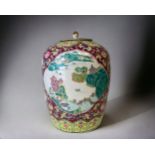 A LARGE CHINESE PORCELAIN LIDDED URN. 20TH CENTURY. HAND PAINTED OVERGLAZE ENAMELS DEPICTING VILLAGE