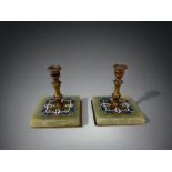 A PAIR OF 19th CENTURY CHAMPLEVE ENAMEL MINIATURE CANDLESTICKS. HEIGHT - 6.5CM