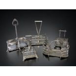 FIVE 19TH CENTURY CHRISTOPHER DRESSER STYLE SILVER PLATE CONDIMENT STANDS.